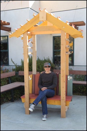 parent sitting in arbor bench